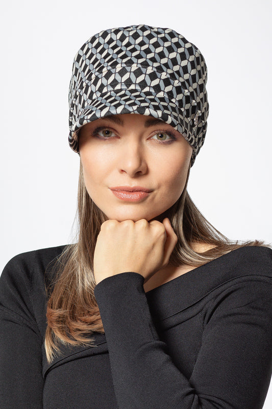 Le Band Move de Gisela Mayer est une couronne de cheveux sur bandeau, facile à enfiler. Résistant à la chaleur, il se lisse ou se boucle pour un style personnalisé.